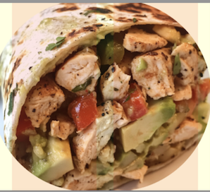 A hearty chicken avocado wrap filled with grilled chicken, fresh vegetables, creamy avocado, and a flavorful sauce, ideal for a quick family lunch.